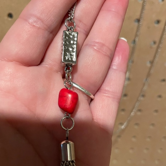 Long silver necklace with a silver triangle, red crackle, and fringe. - Picture 2 of 5